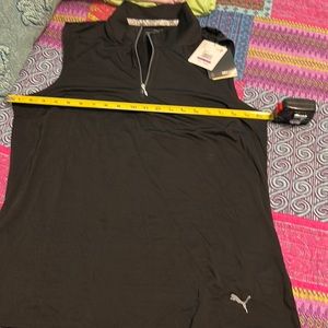 NWT Puma black sleeveless golf polo. Polyester wicking material
